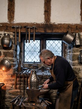 Blacksmith working on a metalwork project