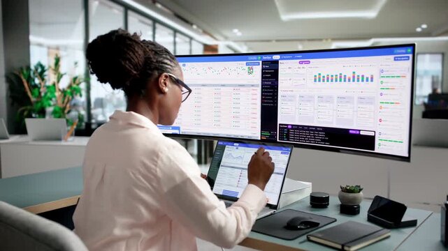 DevOps Engineer Monitors Deployment Pipeline Status On Laptop