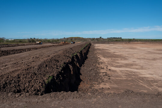 Large scale excavation and earthworks for retention basin at construction site