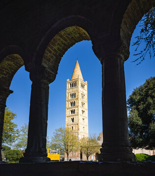 Pomposa Abbey bell tower framed by cloister arches