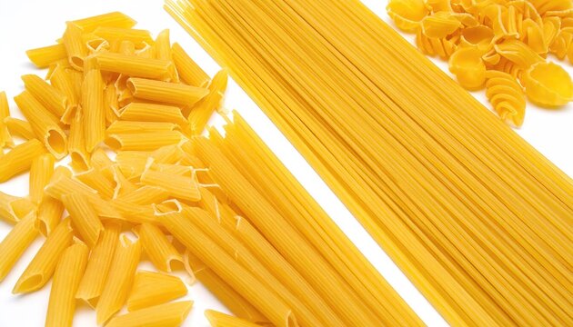 Assortment of various dry raw Italian pasta types including spaghetti, penne and shells on white background