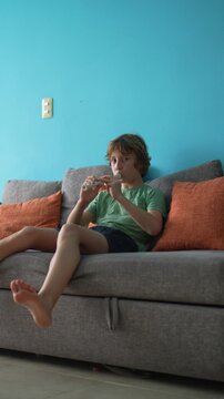 A little boy learns to play the flute at home, practicing with focus and enthusiasm in a cozy, warm setting. A charming scene of early musical exploration, creativity, and childhood growth.