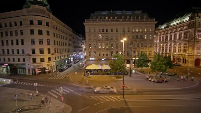 night view of Vienna Austria showing urban streets with illuminated buildings and architecture of the old European city in evening atmosphere
