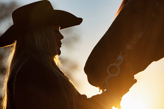 Texas Cowgirl with horse silhouette 