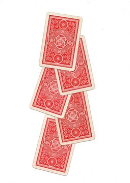 A hand of vintage playing cards isolated on a white background.