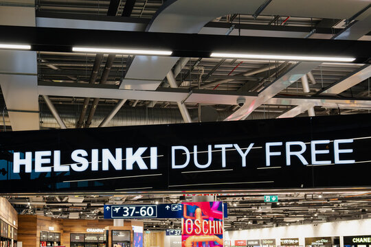 August 15, 2026, Helsinki, Finland - Helsinki Duty Free sign and airport gate information at Helsinki-Vantaa Airport