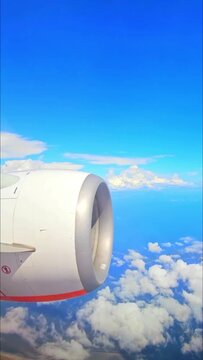 Airplane Engine and Blue Sky Seen Through an Aircraft Window