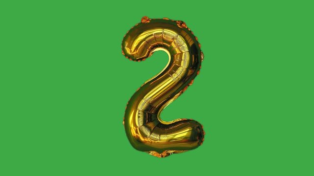 Golden foil balloon number two floating on green screen background