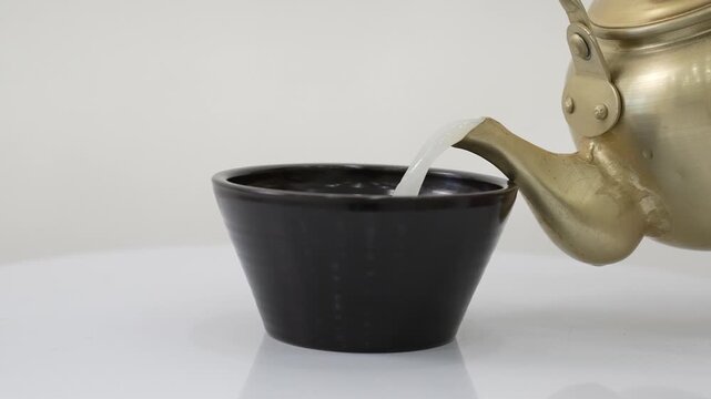 Close-up Fixed Shot of Pouring Traditional Korean Rice Wine Makgeolli into a Bowl (Korean Culture, Beverage)