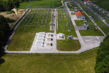 A battery energy storage system near a power grid in a rural area. The facility includes multiple...