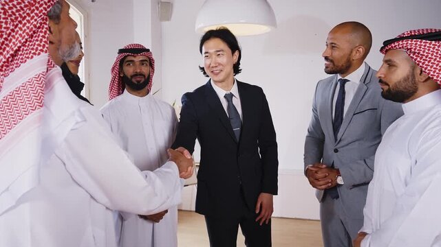 Business professionals discussing project during international office meeting