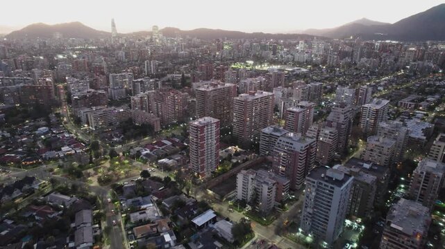 Elevated Drone View Of Santiago Cityscape With Lit Buildings At Twilight, Chile