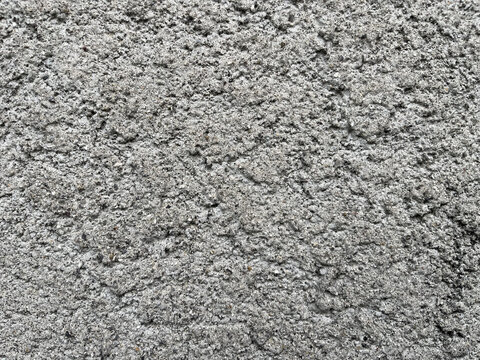 Full frame abstract texture of rough grey cinder block wall background