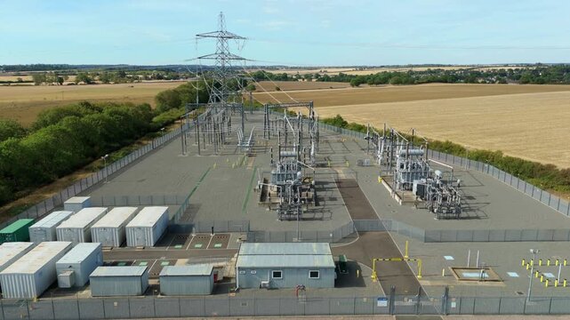 Aerial view of National Grid Ryhall Substation with air cooled transformers and electrical infrastructure in Ryhall, England, United Kingdom.