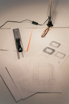 Sketching Design Ideas for Project on a Work Table