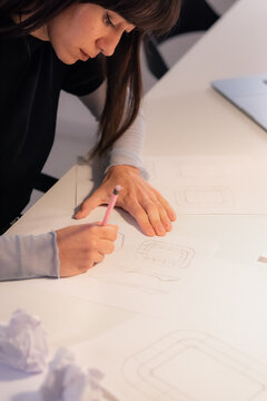 Woman creating new designs at work