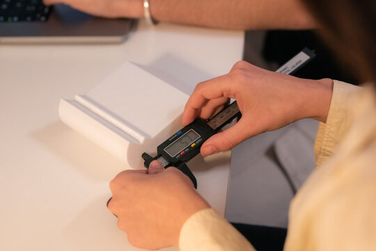 Measuring an Object With a Caliper in a Workspace