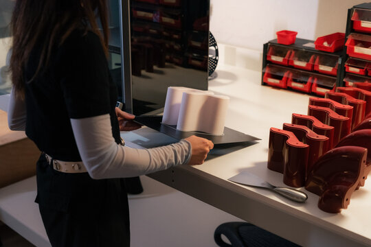 Woman making designer goods using 3d printer