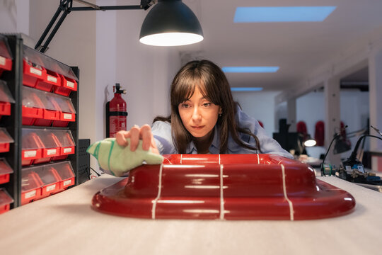 Woman polishing product at workshop