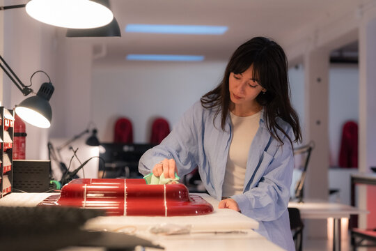 Woman finishing product at workshop