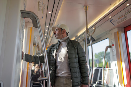 Male Passenger Standing inside Moving Amsterdam Tram
