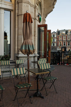 Empty Sidewalk Cafe Table and Chairs in Amsterdam