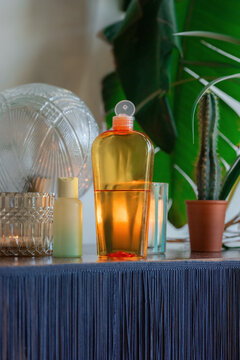 Massage oil near plants and candle