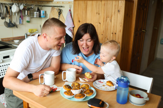 The family is spending time in the kitchen