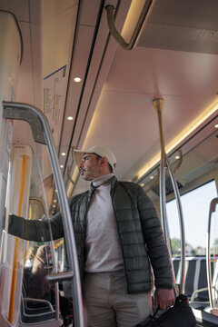Male Passenger Standing inside Moving Amsterdam Tram