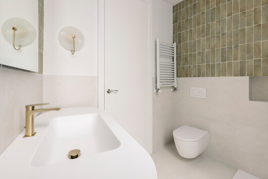 Modern bathroom with green tiles