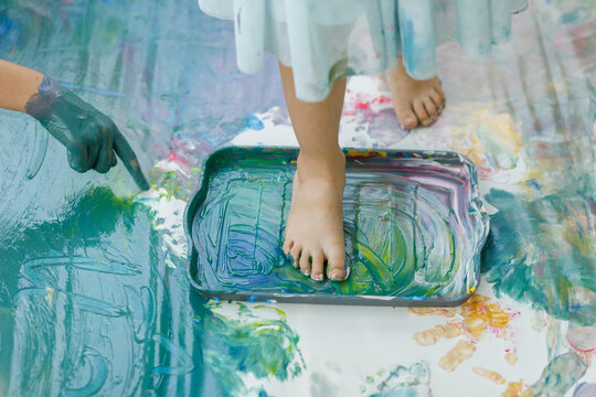 Child's foot on tempera palette 