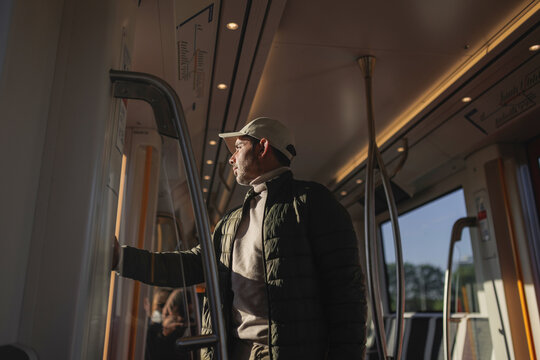 Male Passenger Standing inside Moving Amsterdam Tram