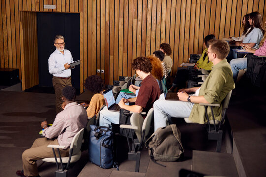 Students Listen to a Teacher