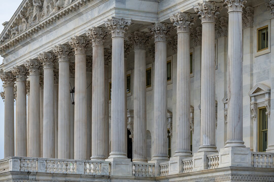 Columns marble Tall vertical structure. Columns fluted architectural symmetry. Columns decorative capitals ornament Sculpture. Columns classical heritage exterior.