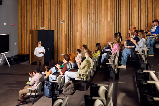 Students applaud to their professor