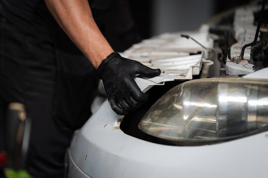 Mechanic Aligning Front Bumper