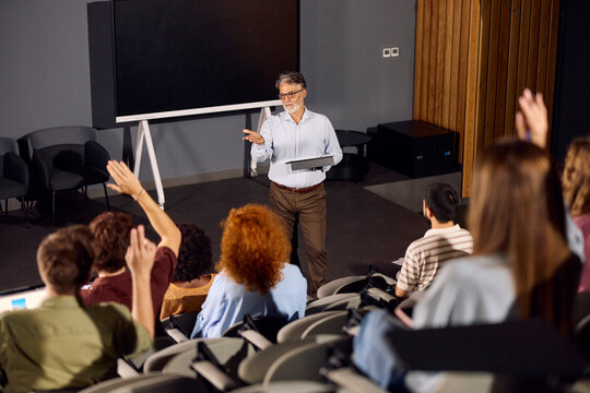 Professor interacts with his students during a lecture