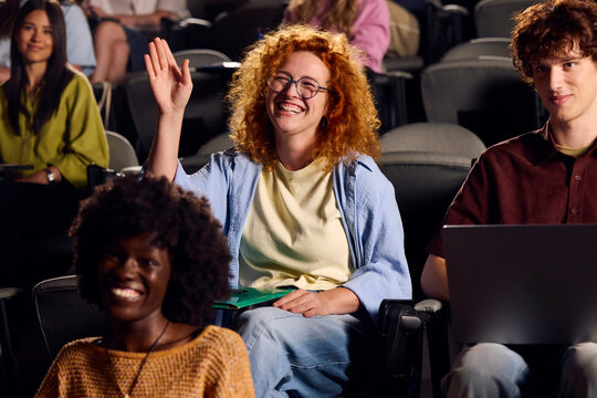 Excited student asks questions during a lecture.