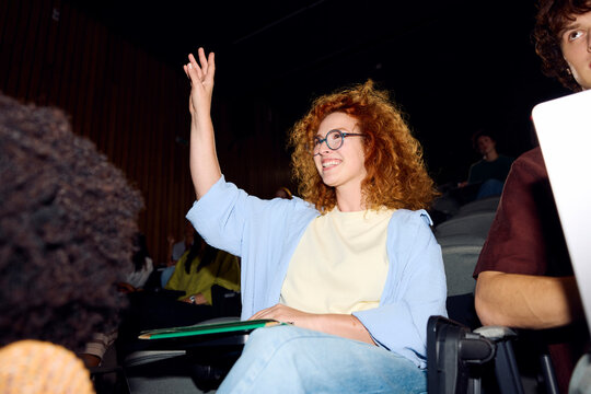 Student asks a question during a lecture.
