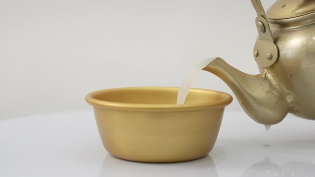 Close-up Fixed Shot of Pouring Traditional Korean Rice Wine Makgeolli into a Bowl (Korean Culture, Beverage)