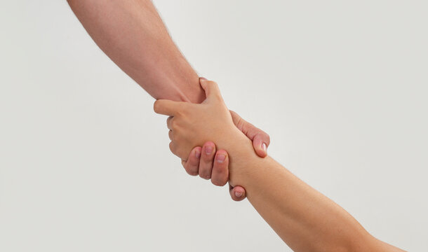 Partnership starts with strong handshake. Partnership creates agreement and success. Helping hands show partnership support. Closeup grip defines partnership concept.