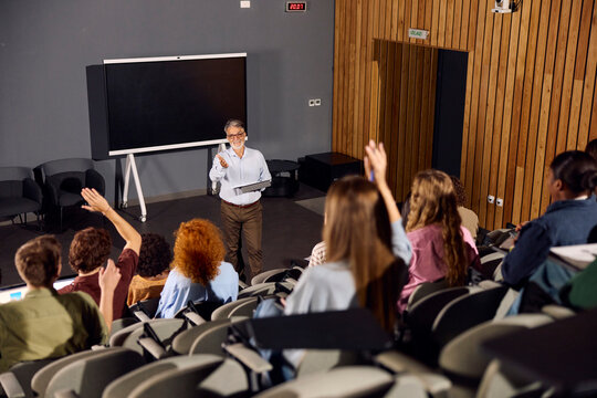 Professor interacts with his students during a lecture