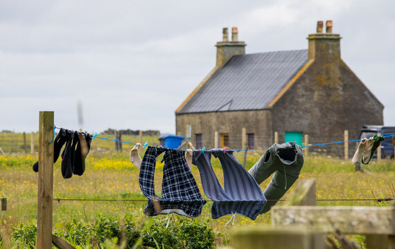 Laundry drying on the line outside a croft house on the Isle of Lewis
