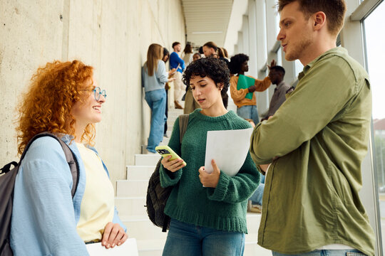 Students Interact in a Modern University Building