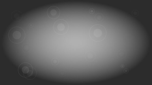 Abstract gray background featuring soft glowing circular light patterns