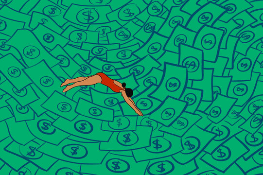 A woman dives into a sea of money