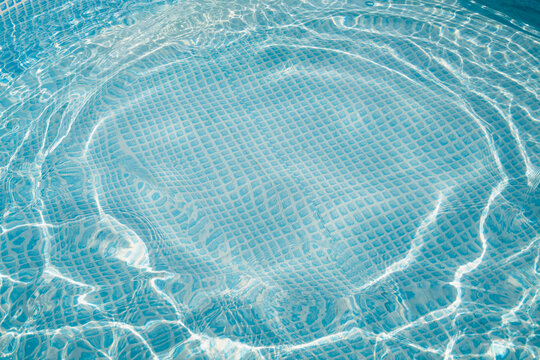 Clear Swimming Pool Water with Sunlight Reflections
