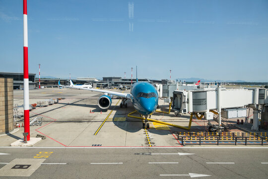 Airplane Parked at Airport Gate
