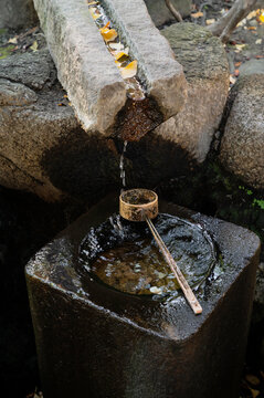 Traditional Japanese Stone Water Basin and Bamboo Ladle
