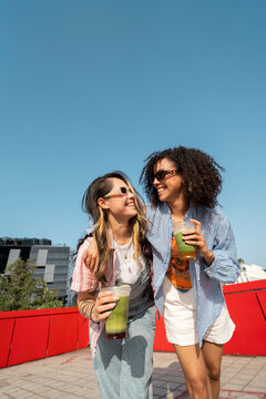 Friends Enjoy Time Outdoors Under Blue Sky